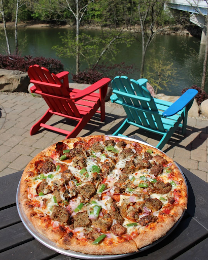 Wood fired pizza with assorted toppings served on riverside patio at Little Miami Brewing Company in Milford.