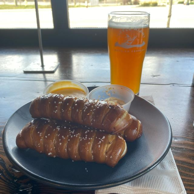 Shot of the best beer Shot of the best beer pairing featuring meat sandwiches, with dips, and Hazy IPA from Little Miami Brewing company.