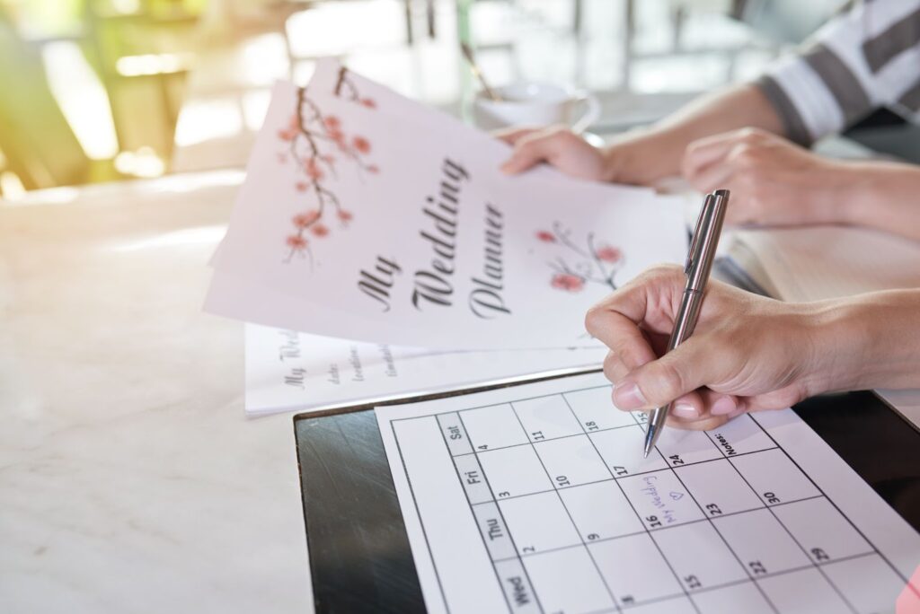 A couple excitedly planning their wedding, A couple excitedly planning their wedding, highlighting the joy and anticipation that comes with choosing wedding venues and making their dream day a reality.