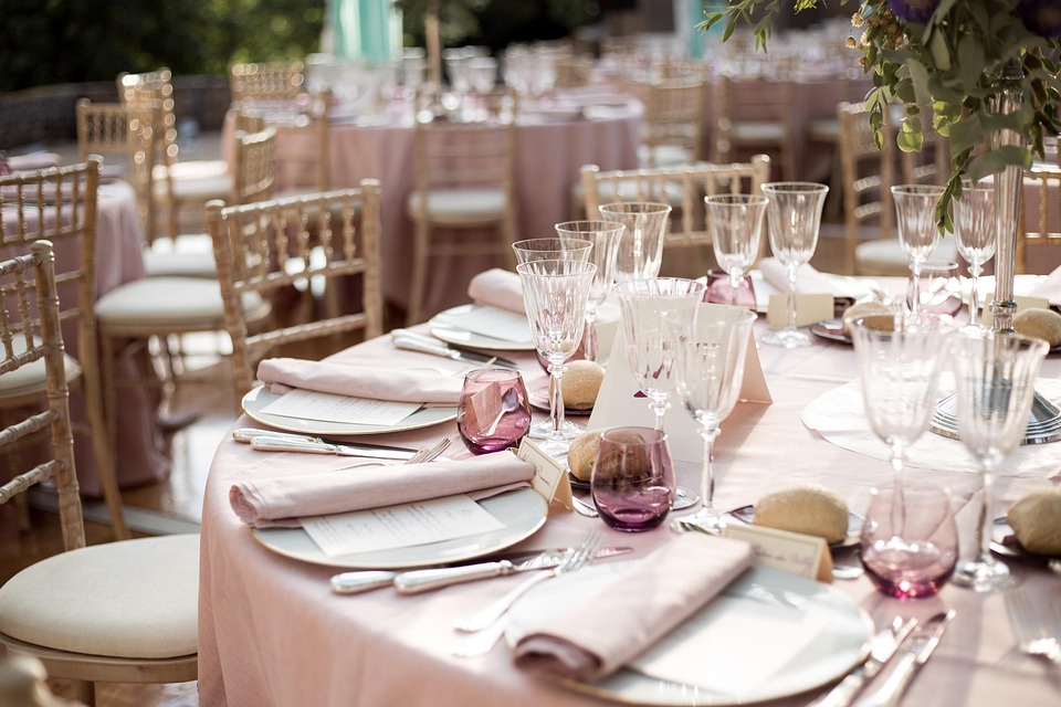 Elegant rustic wedding table setup with greenery and candles at Little Miami Event Centre in Cincinnati.