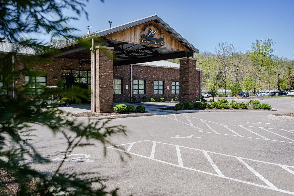 Exterior of Little Miami Brewing Company with riverside views, ideal for Cincinnati weddings.