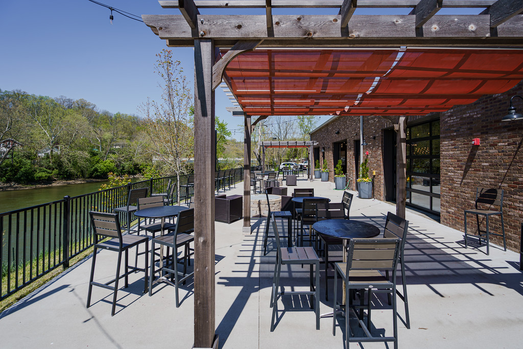 Riverside event space at Little Miami Brewing Company with scenic views of the Little Miami River in Cincinnati.